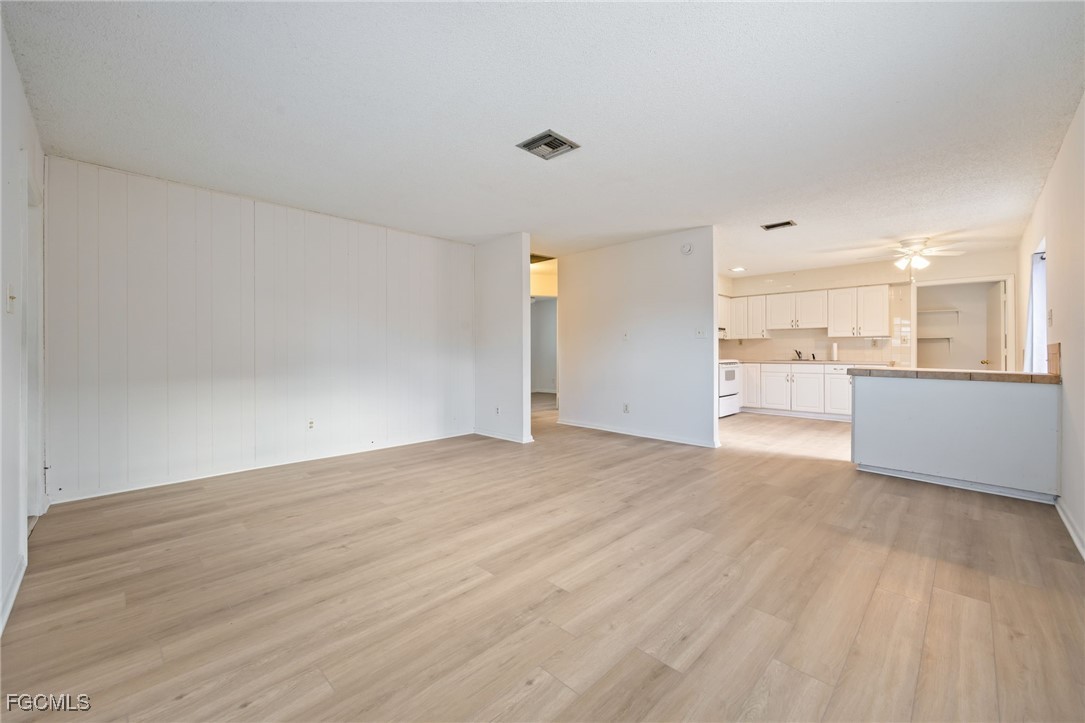 12955 First Street Fort Myers, FL 33905 - Photo 26 of 48 a view of a kitchen with a sink and a refrigerator