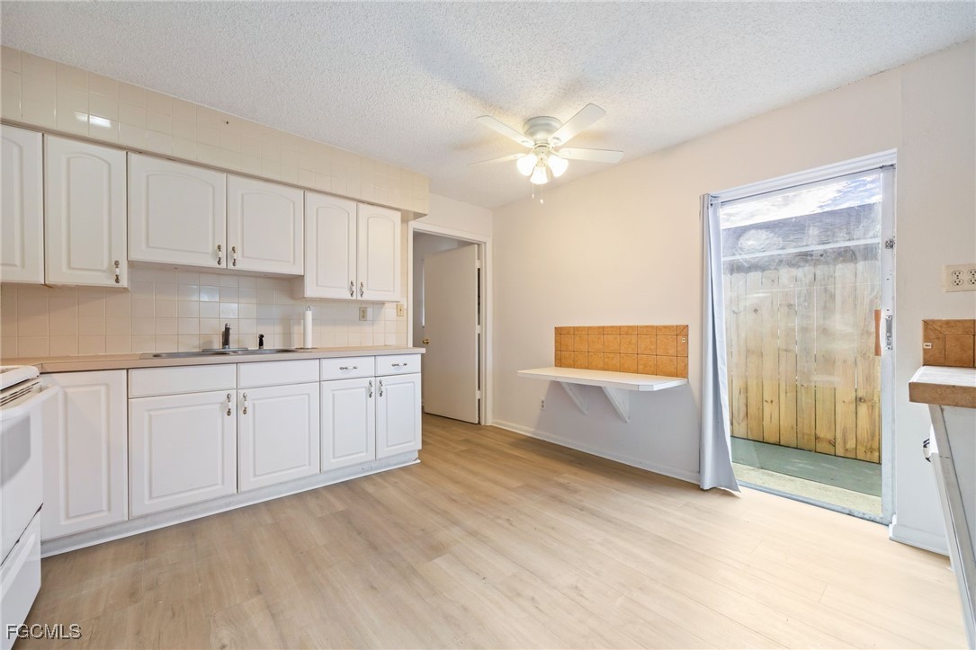12955 First Street Fort Myers, FL 33905 - Photo 29 of 48 a view of kitchen with wooden floor and window