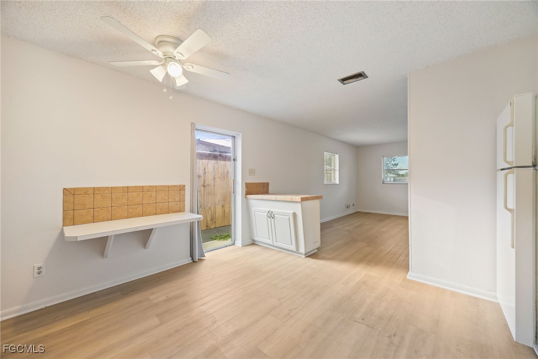 12955 First Street Fort Myers, FL 33905 - Photo 32 of 48 a view of a kitchen with a sink dishwasher and a refrigerator