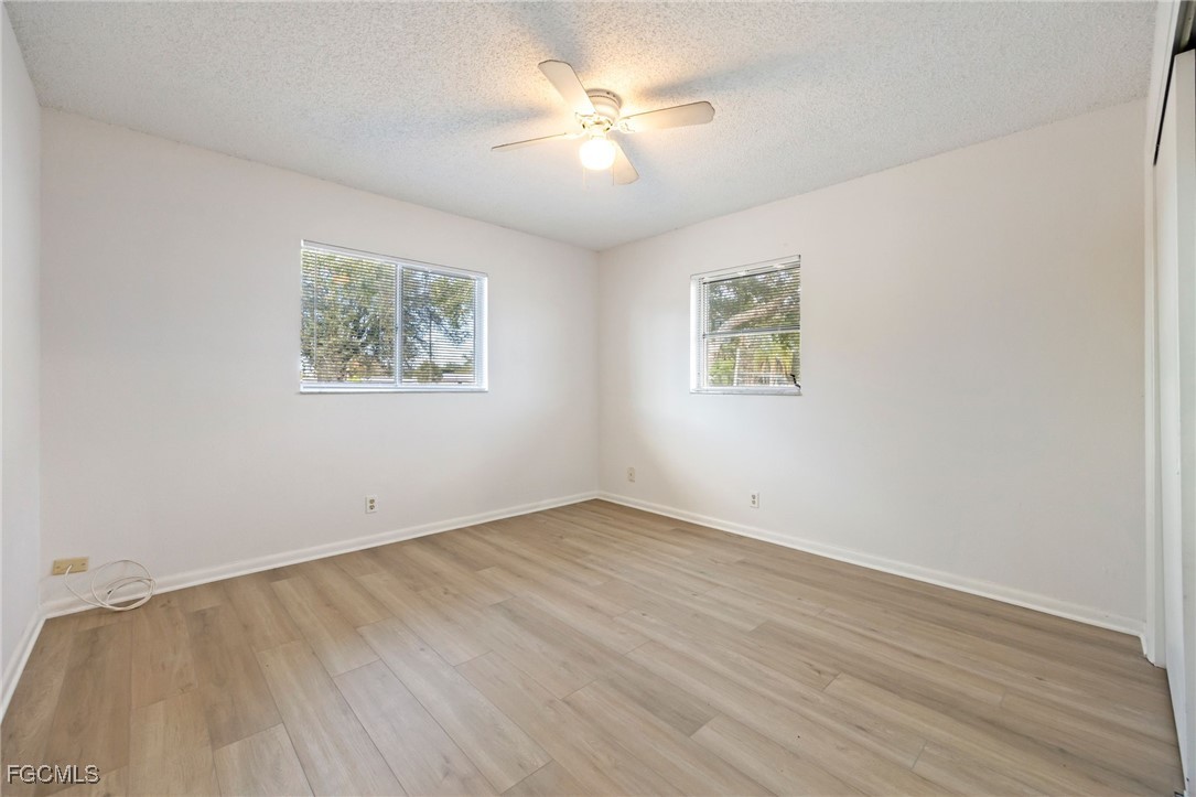 12955 First Street Fort Myers, FL 33905 - Photo 33 of 48 wooden floor in an empty room with a window