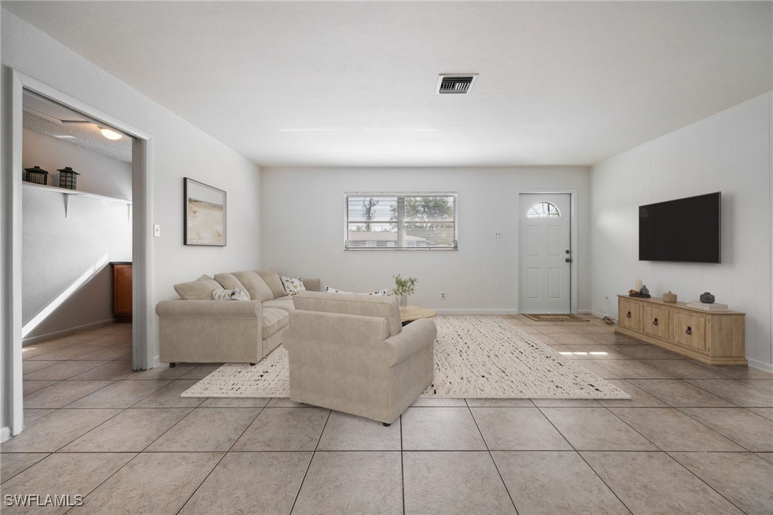 12955 First Street Fort Myers, FL 33905 - Photo 6 of 48 a living room with furniture and a flat screen tv