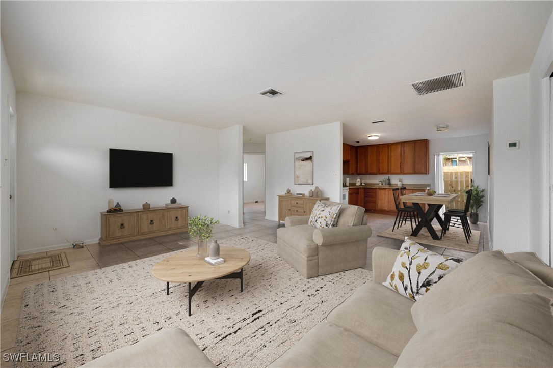 12955 First Street Fort Myers, FL 33905 - Photo 9 of 48 a living room with furniture and a flat screen tv