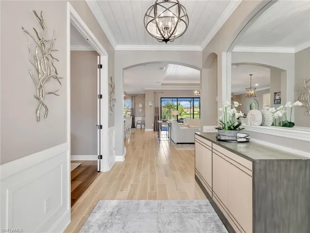 a kitchen with a refrigerator and a sink