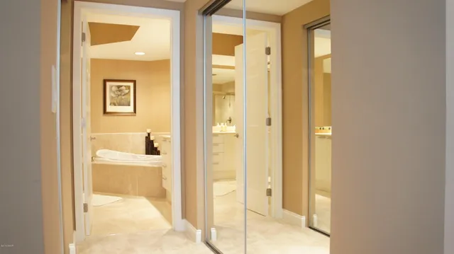 a bathroom with a glass shower door