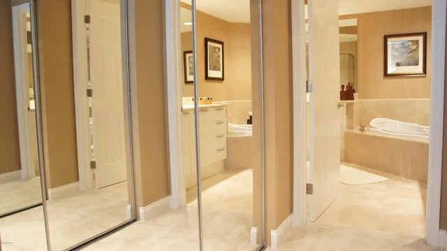 a bathroom with a bathtub and shower
