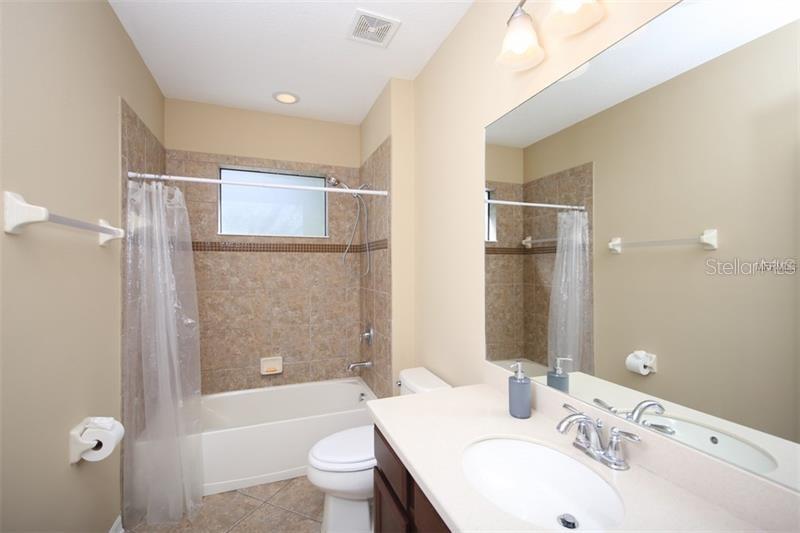 4169 Overture Circle, Unit 389 Bradenton, FL 34209 - Photo 15 of 25 a bathroom with a sink toilet tub and shower