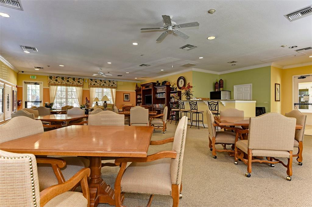 4169 Overture Circle, Unit 389 Bradenton, FL 34209 - Photo 21 of 25 a view of a dining room with furniture