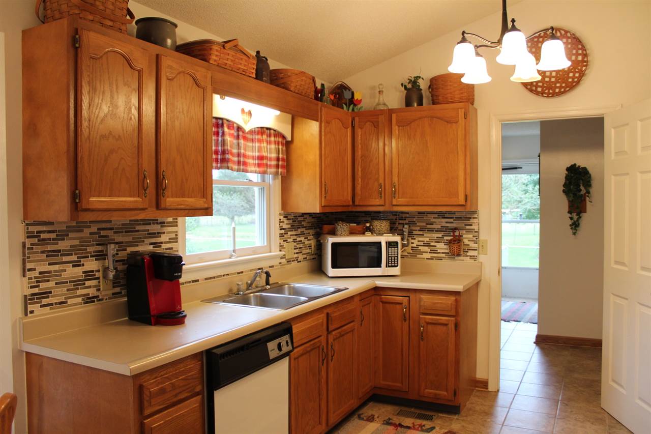 7522 Spring Creek Road Bridgewater, VA 22812 - Photo 8 of 22 a kitchen with a refrigerator a sink and dishwasher