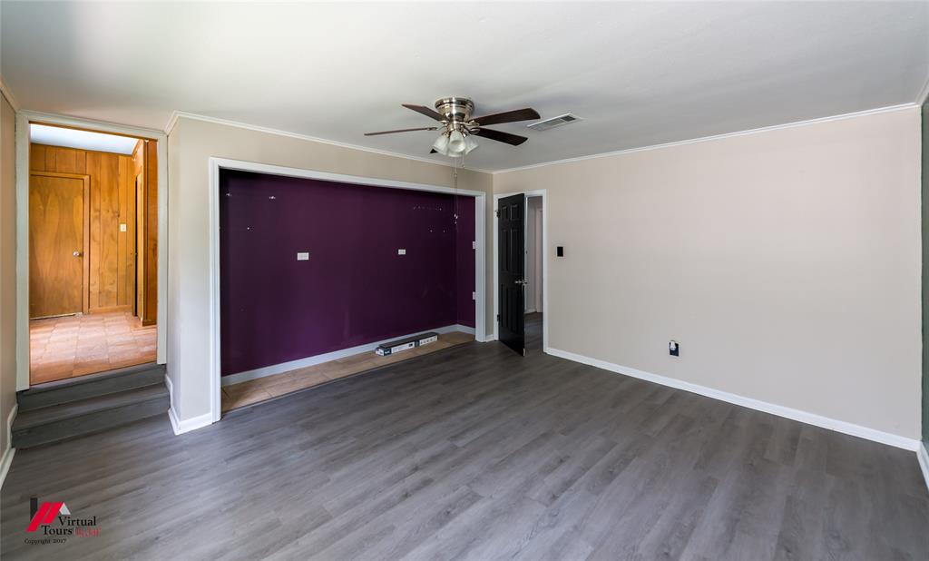 3109 Gorton Road Shreveport, LA 71119 - Photo 23 of 31 an empty room with wooden floor a ceiling fan and closet area