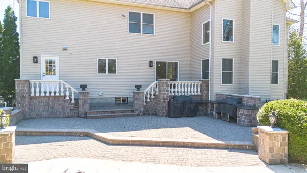an aerial view of a house with a ocean view
