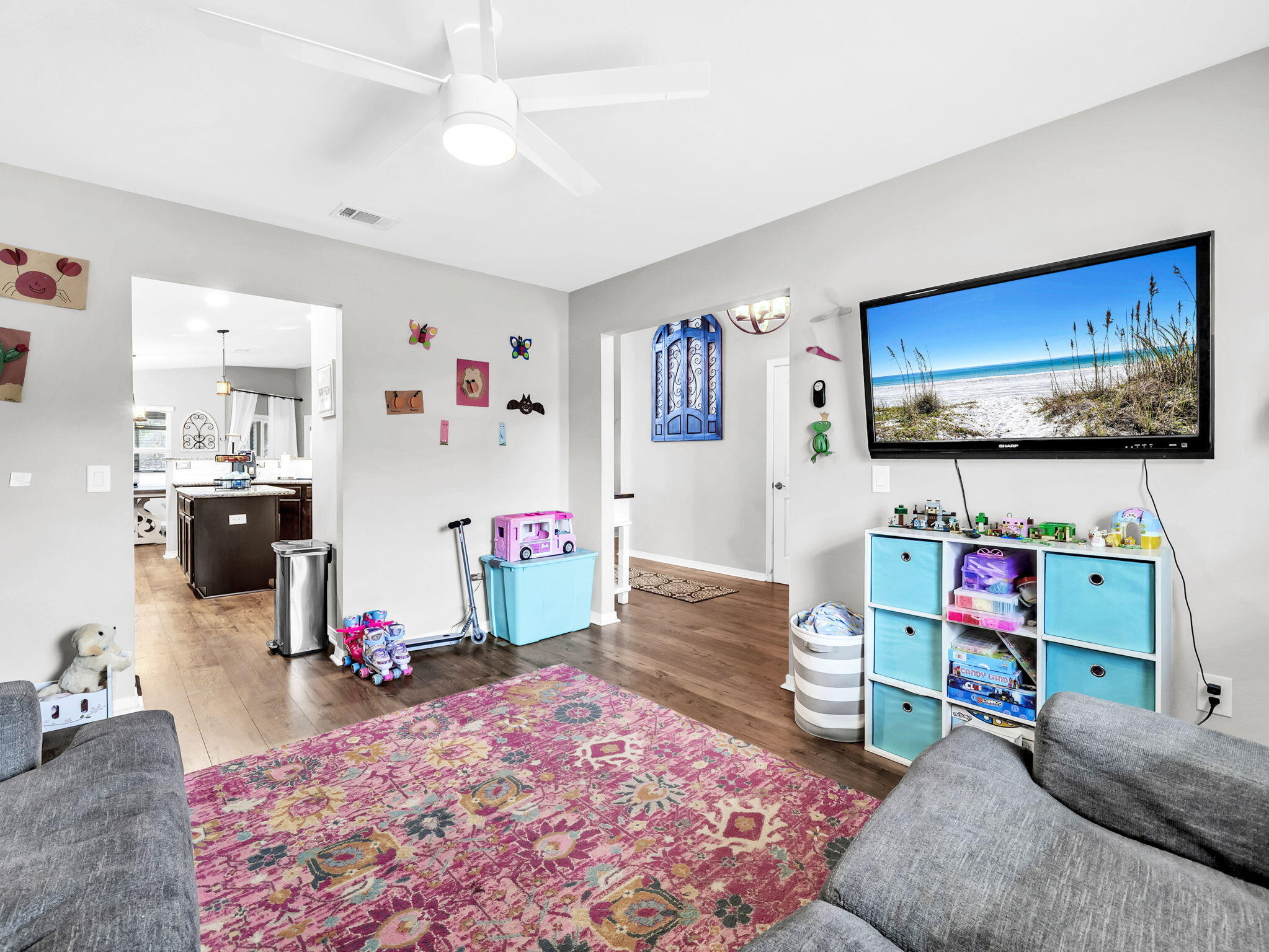 9119 Timber Lane Navarre, FL 32566 - Photo 11 of 53 a living room with furniture and a flat screen tv