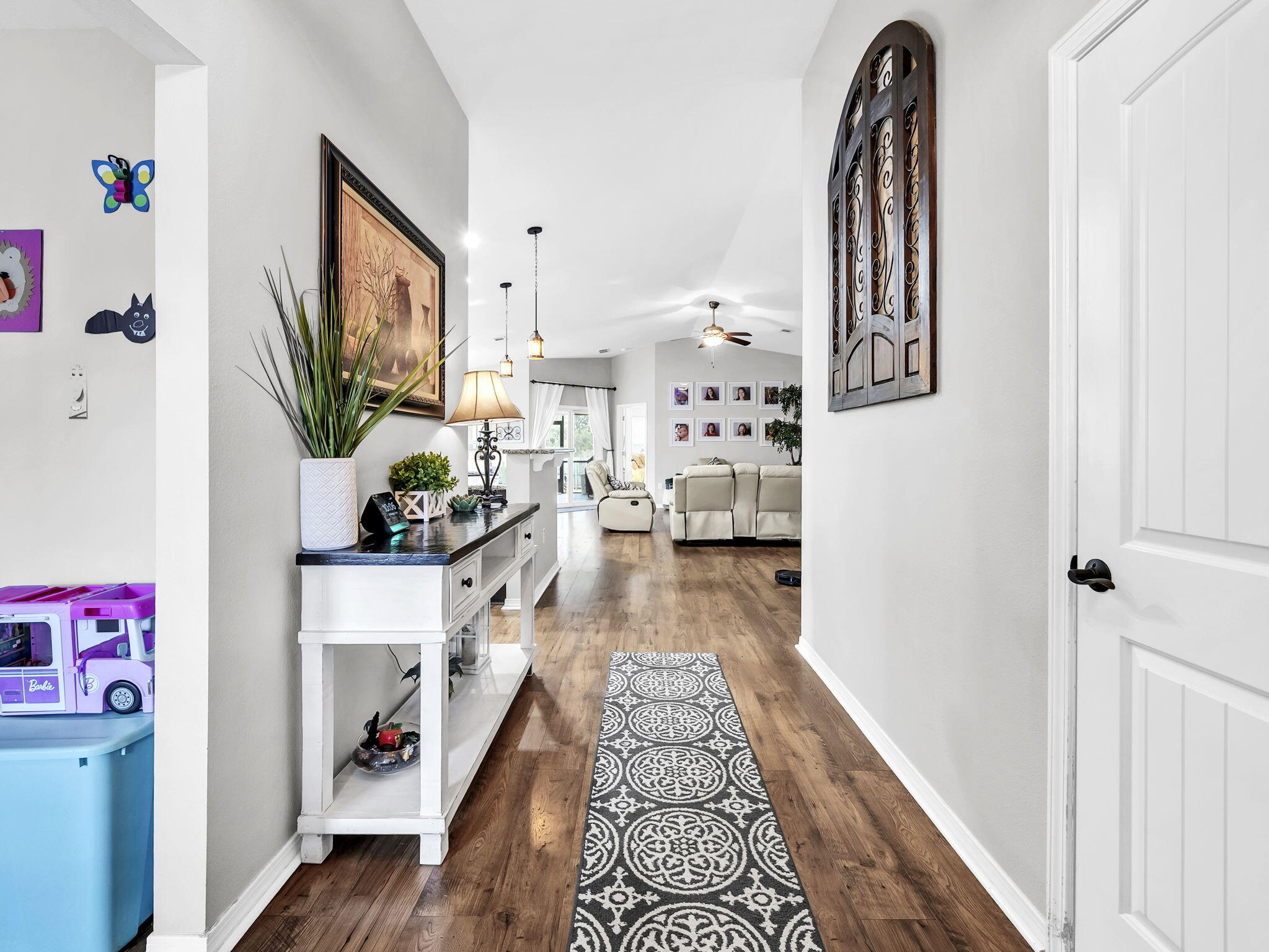 9119 Timber Lane Navarre, FL 32566 - Photo 12 of 53 a view of living room with furniture and wooden floor