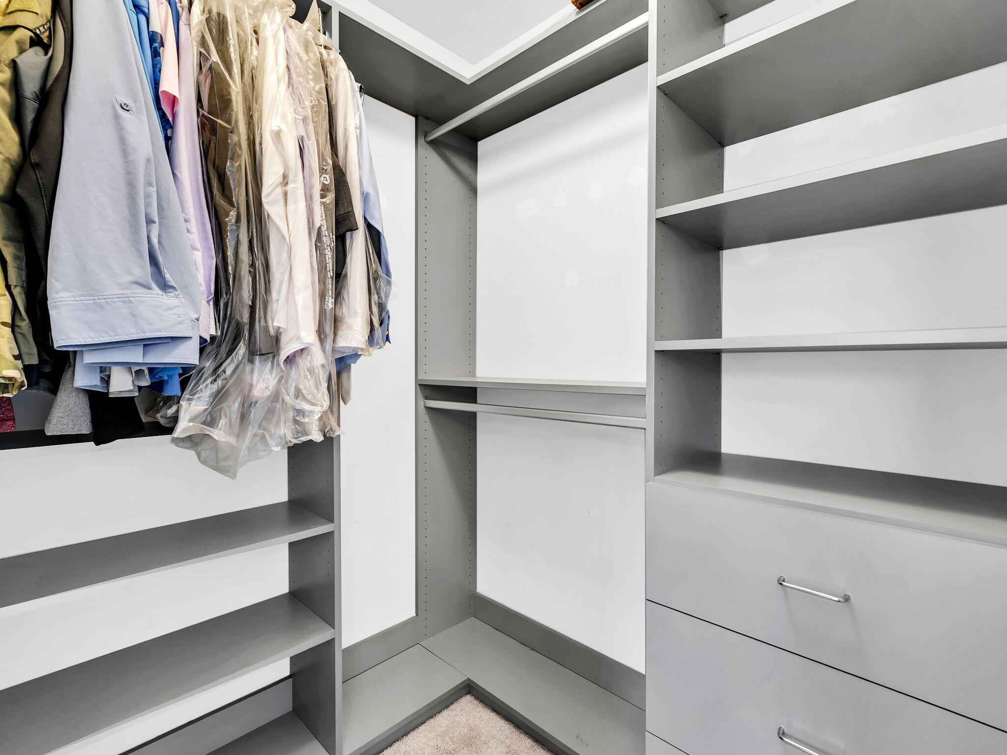 9119 Timber Lane Navarre, FL 32566 - Photo 33 of 53 a view of walk in closet with clothes and shoes