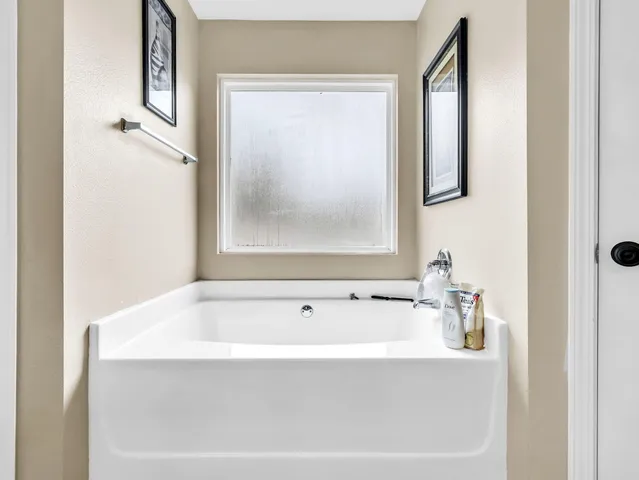 a bedroom with a bed and dresser