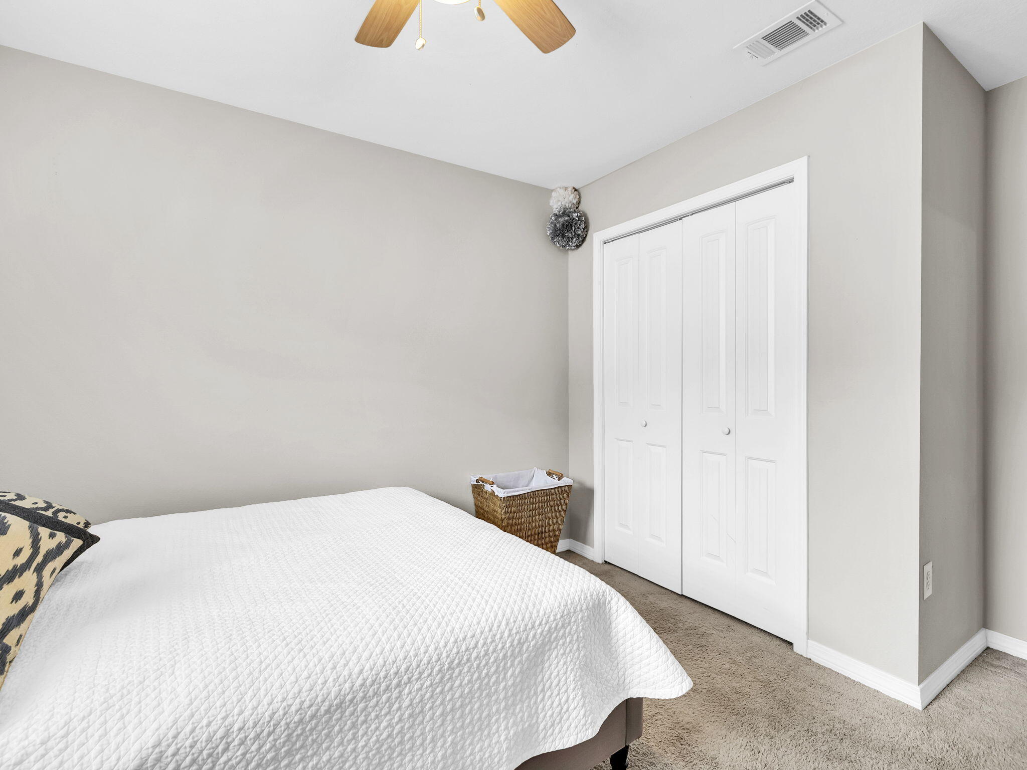 9119 Timber Lane Navarre, FL 32566 - Photo 38 of 53 a bedroom with a bed and cabinets