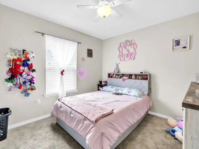 a bathroom with a sink toilet and mirror