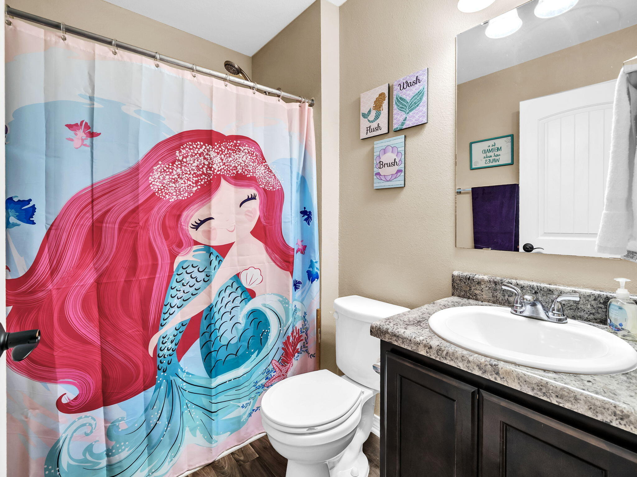 9119 Timber Lane Navarre, FL 32566 - Photo 41 of 53 a bathroom with a sink toilet and mirror