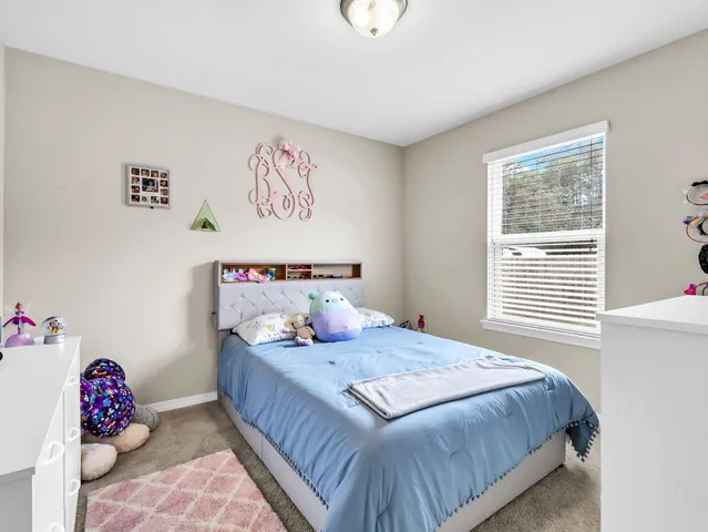 a view of a hallway with washer and dryer