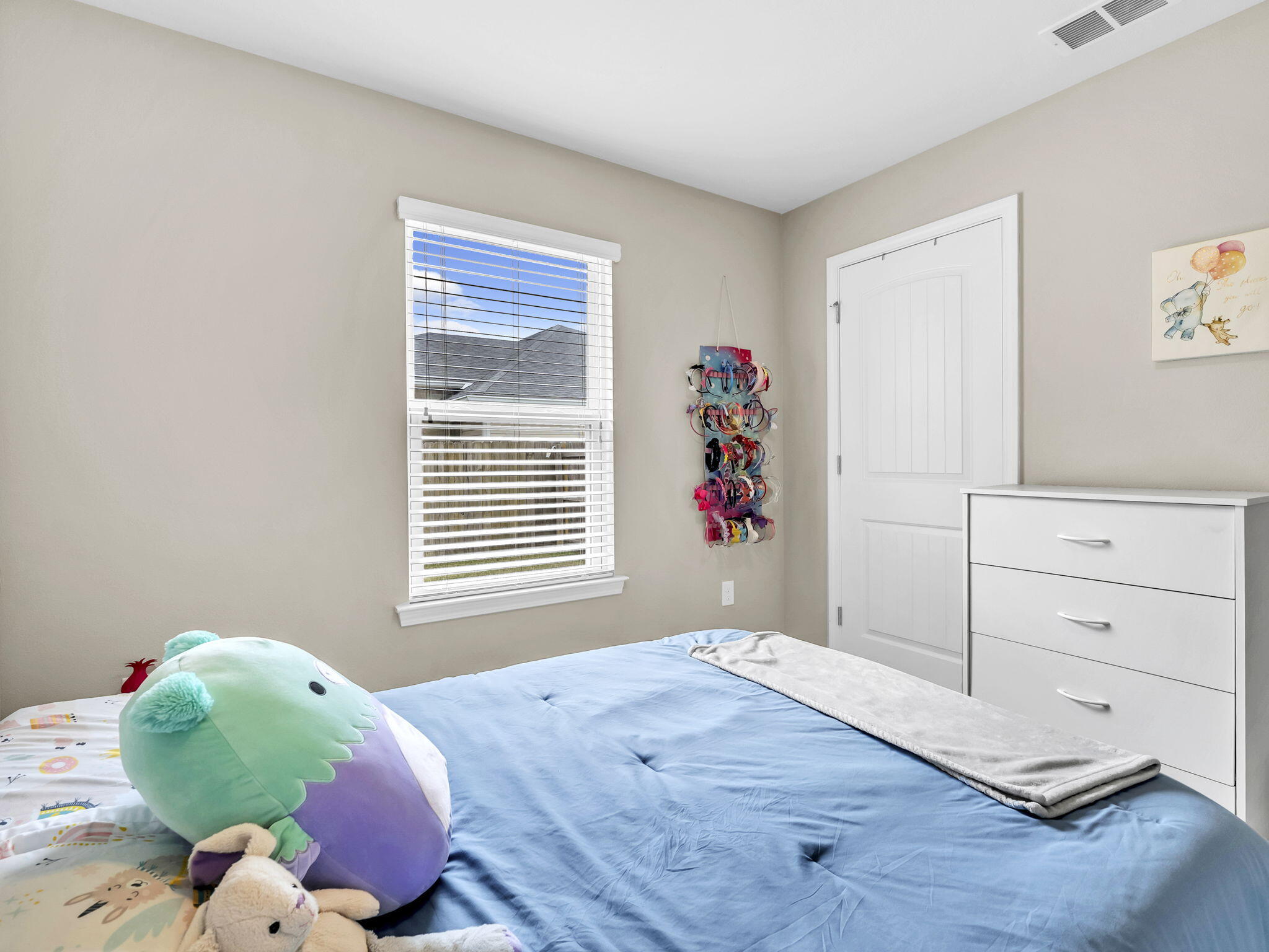 9119 Timber Lane Navarre, FL 32566 - Photo 43 of 53 a bedroom with a bed and window