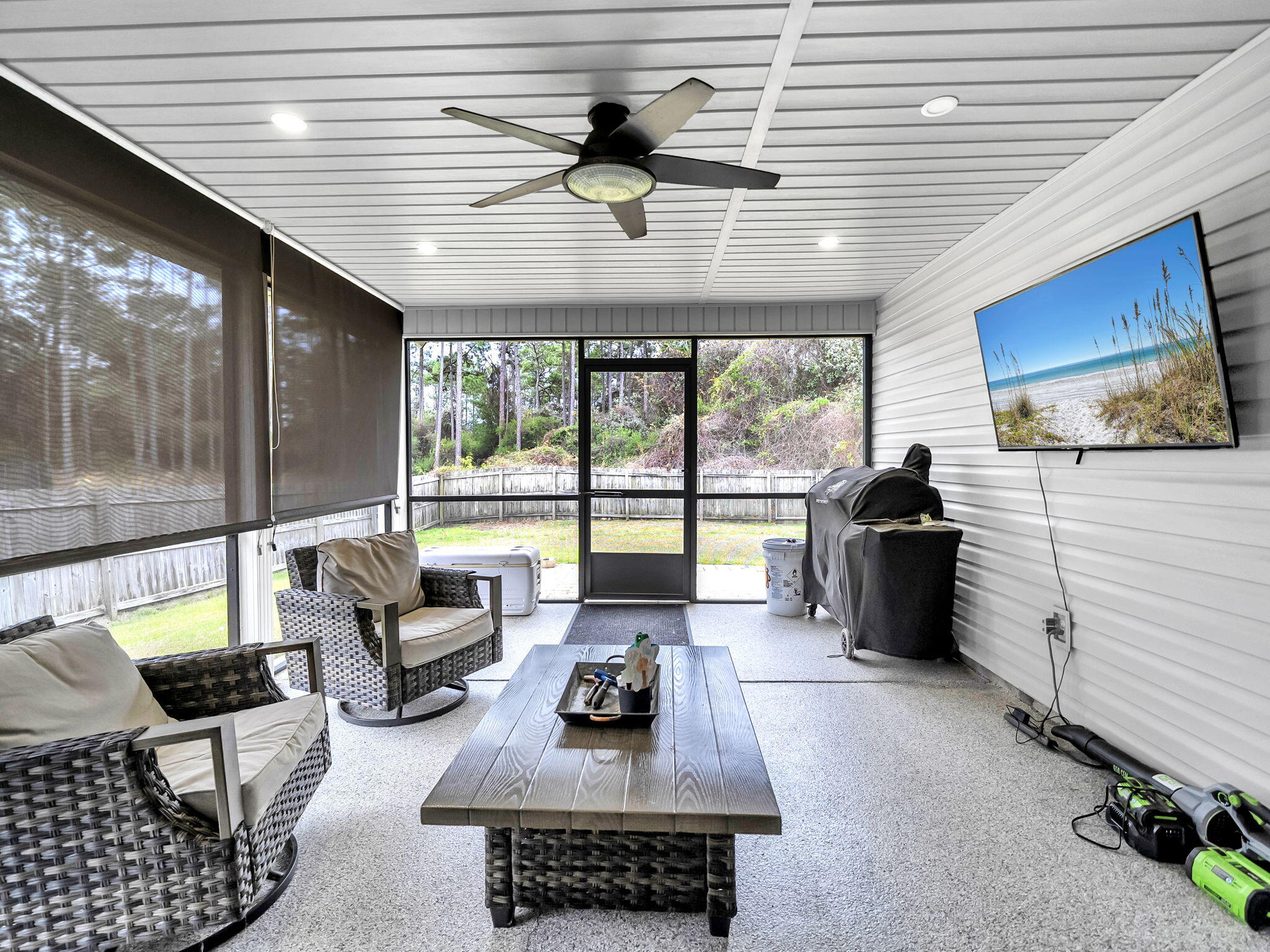 9119 Timber Lane Navarre, FL 32566 - Photo 46 of 53 a living room with furniture and a floor to ceiling window