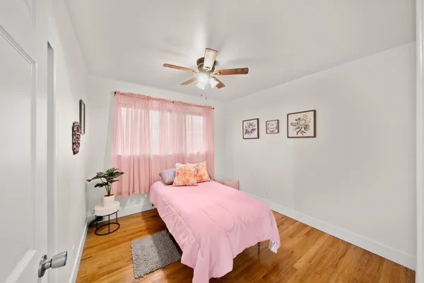 a bed room with a bed and a chandelier