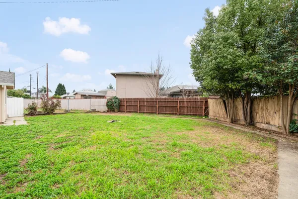 a view of a back yard of the house