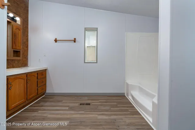 a view of a bathroom from the hallway