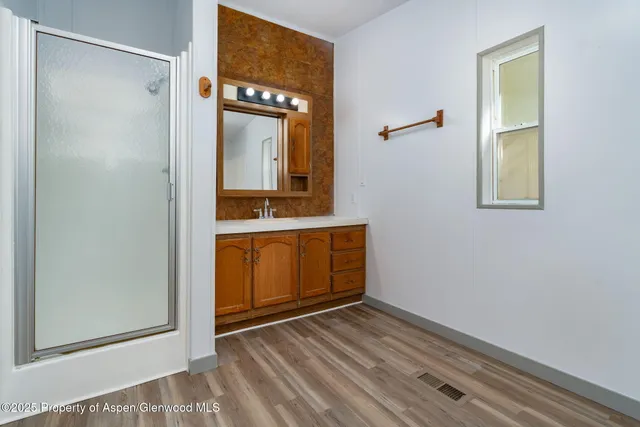 a bathroom with a bathtub and shower