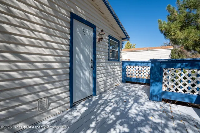 a view of a backyard with open kitchen