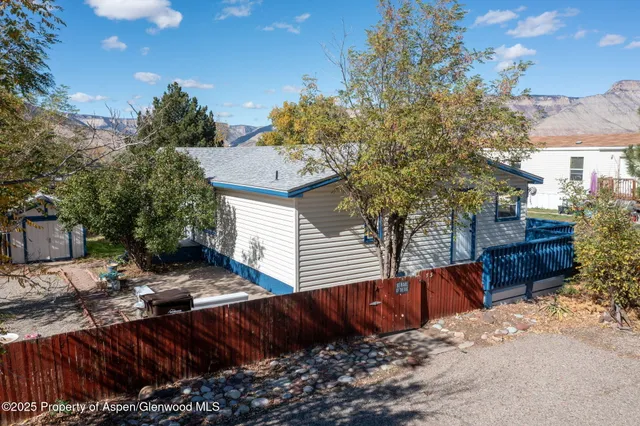 a view of a backyard with sitting area