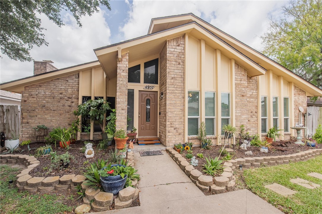 4957 Shadowbend Drive Corpus Christi, TX 78413 - Photo 1 of 35 a front view of a house with swimming pool outdoor seating