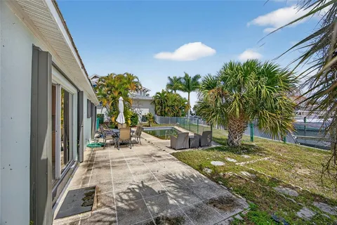 a view of a patio with swimming pool