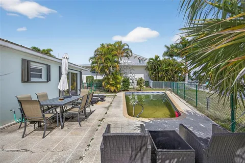 a view of swimming pool with chairs