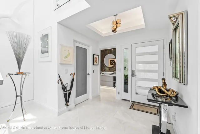 a living room with lots of furniture and kitchen view