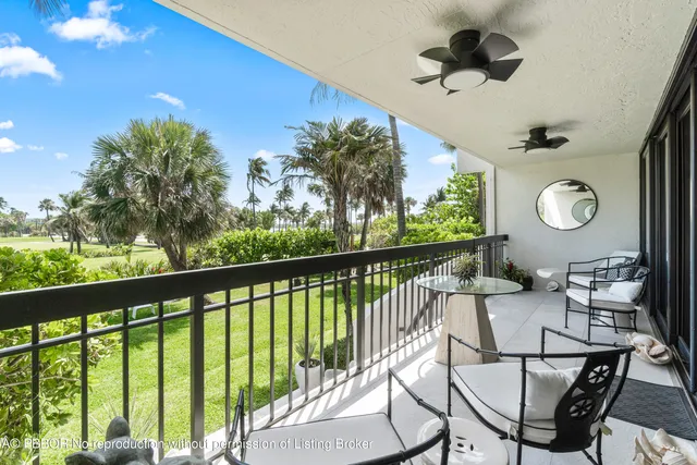 a view of kitchen island with furniture and chandelier