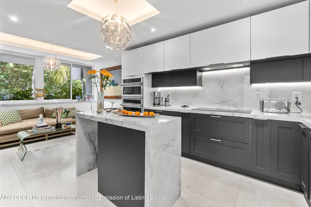 a spacious bedroom with a bed a couch and a large window