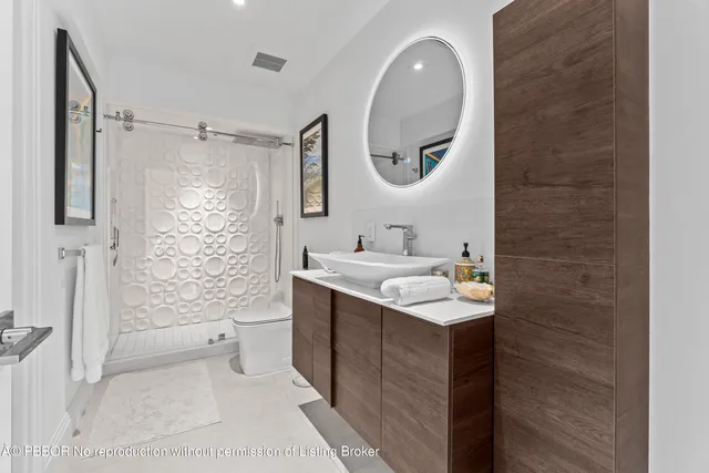 a view of a street with potted plants