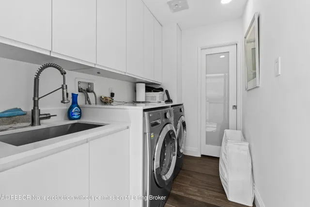 a view of a swimming pool with a yard and plants