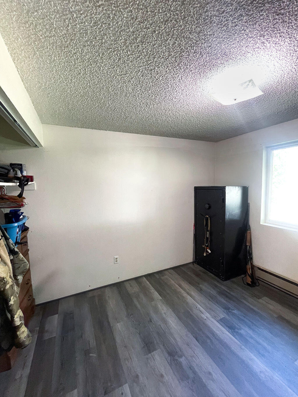 3037 Clearbrook Place Malin, OR 97632 - Photo 20 of 30 an empty room with wooden floor and windows