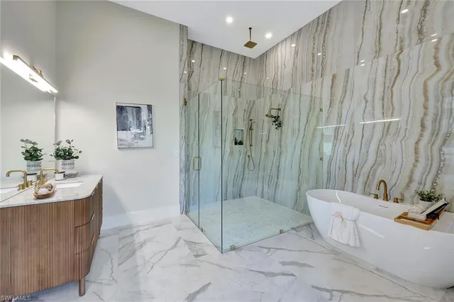 a spacious bathroom with a shower sink and mirror