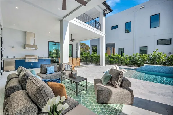 a living room with furniture and a garden