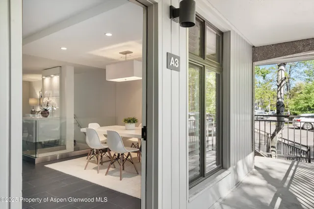 a view of a dining room with furniture window and outside view
