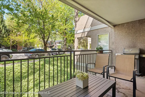 a view of balcony with wooden floor