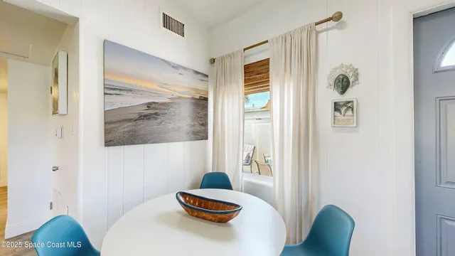 a bedroom with a bed and a flat tv screen