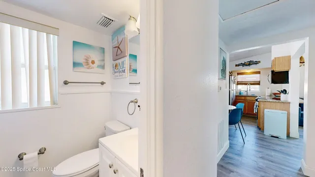 a bedroom with a bed and a television