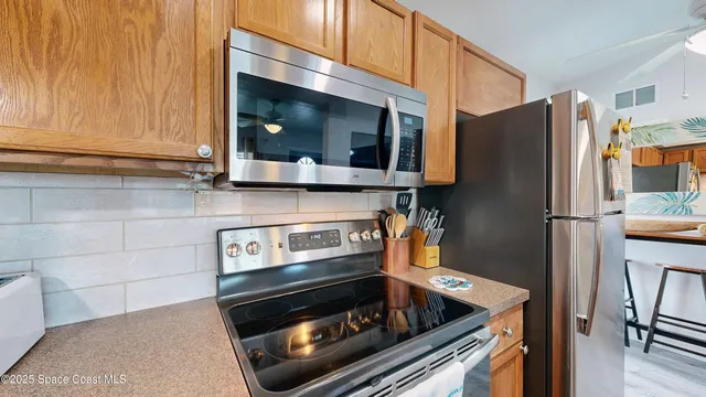 a view of a kitchen with washer and dryer
