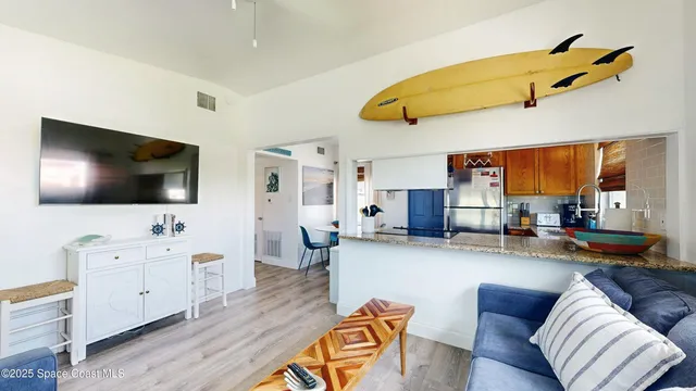 a kitchen with a refrigerator and a stove