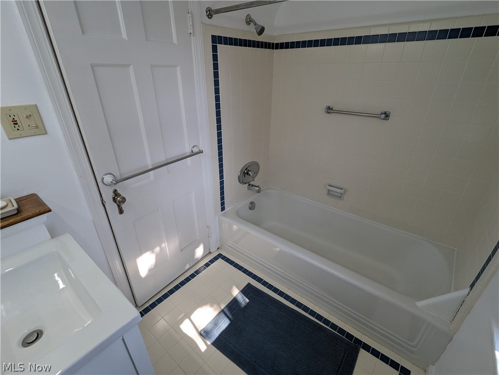 1050 Renfield Road Cleveland Heights, OH 44121 - Photo 22 of 41 Bathroom with vanity, tiled shower / bath, and tile flooring
