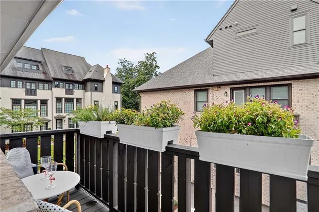 a view of a chair and table in the house front view