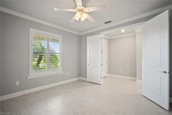 a view of an empty room with a window